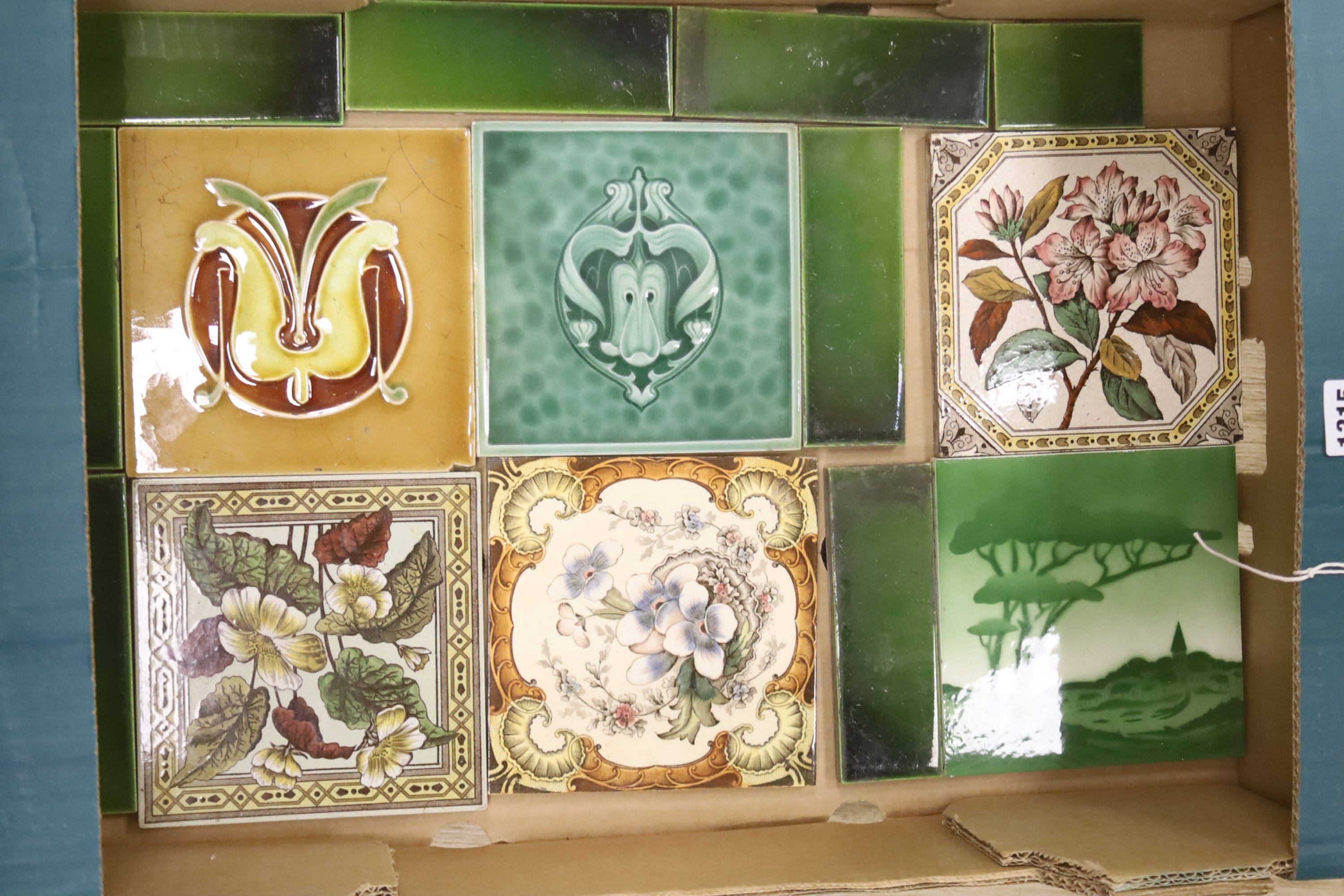 A collection of Victorian ceramic tiles and spacers